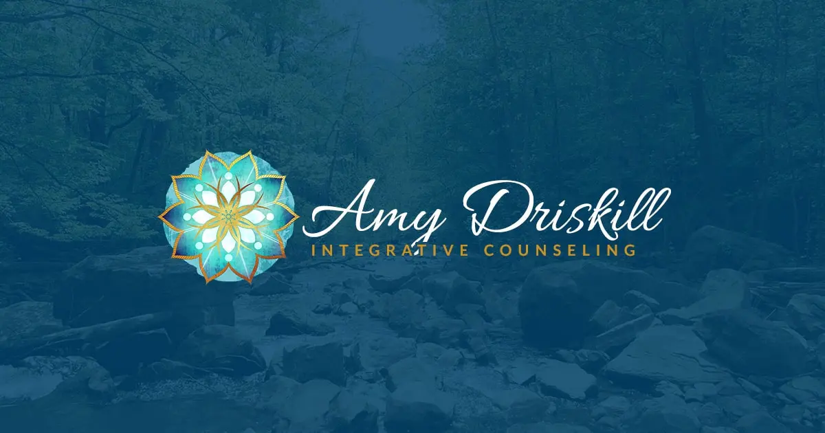 Logo for Amy Driskill Integrative Counseling, featuring a turquoise and gold mandala design on the left and elegant script text on the right that reads “Amy Driskill” with “Integrative Counseling” in uppercase gold lettering underneath. The background is a semi-transparent forest and creek scene with a blue overlay.